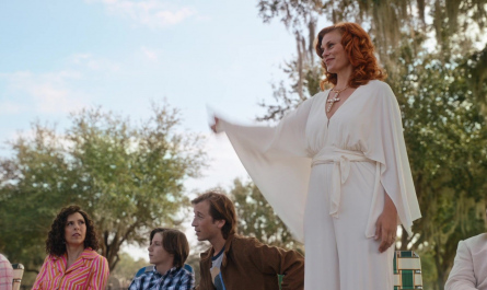 White V-neck jumpsuit with wide sleeves and tie belt of Cassidy Freeman as Amber Gemstone Outfit The Righteous Gemstones TV Show
