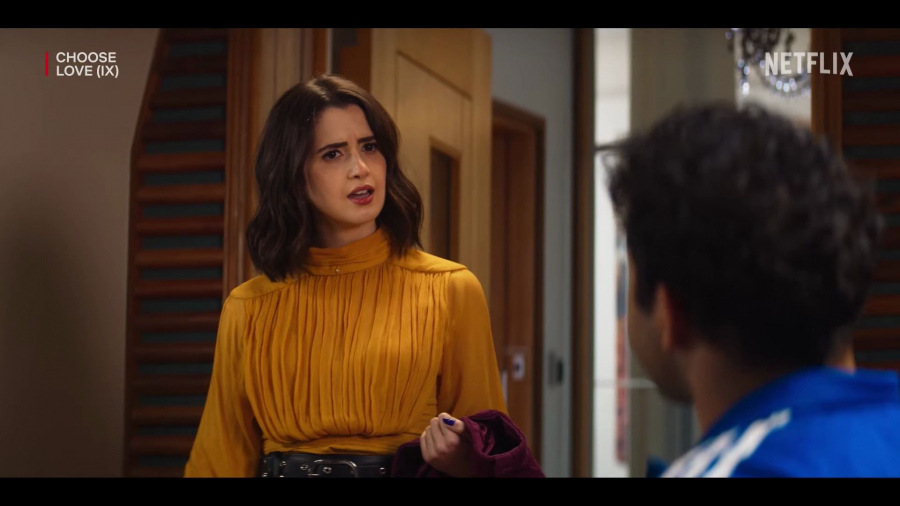 orange ruffle blouse - Laura Marano (Cami) - Choose Love (2023) Movie