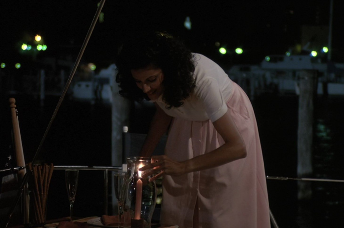 Pink button front midi skirt of Saundra Santiago as Detective Regina "Gina" Navarro Calabrese Outfit Miami Vice TV Show