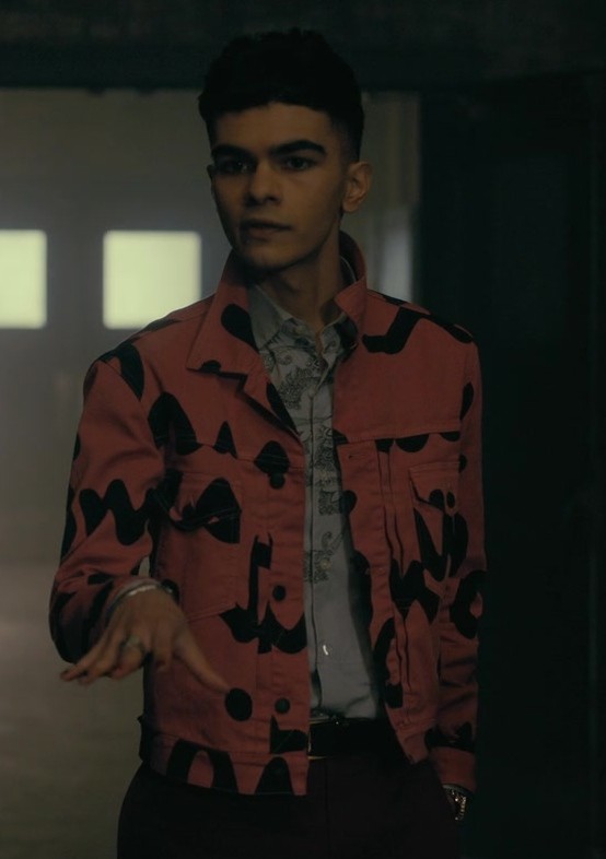 coral jacket with bold black abstract patterns - Sauriyan Sapkota (Prospero "Perry" Usher) - The Fall of the House of Usher TV Show