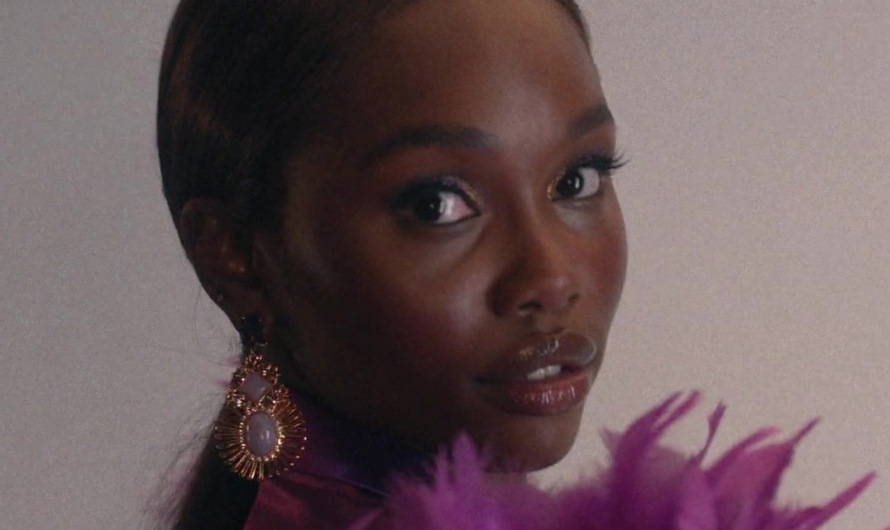 Gold-Tone Radiant Sunburst Earrings with Central Opalescent Stone of Laura Kariuki as Vivian Lee Finch