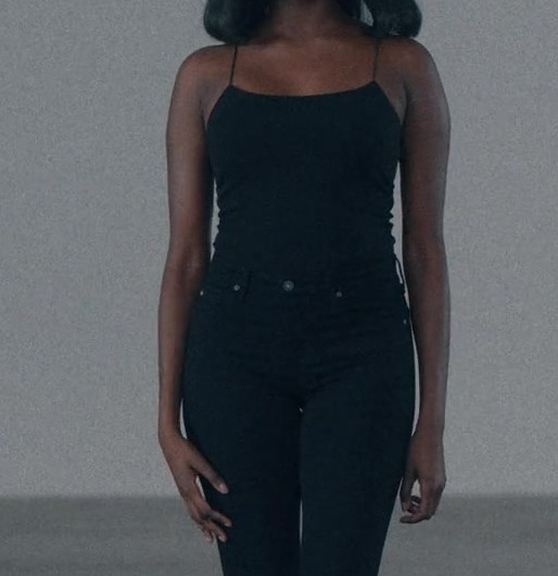 Black Slim-Fit Spaghetti Strap Camisole Top of Laura Kariuki as Vivian Lee Finch