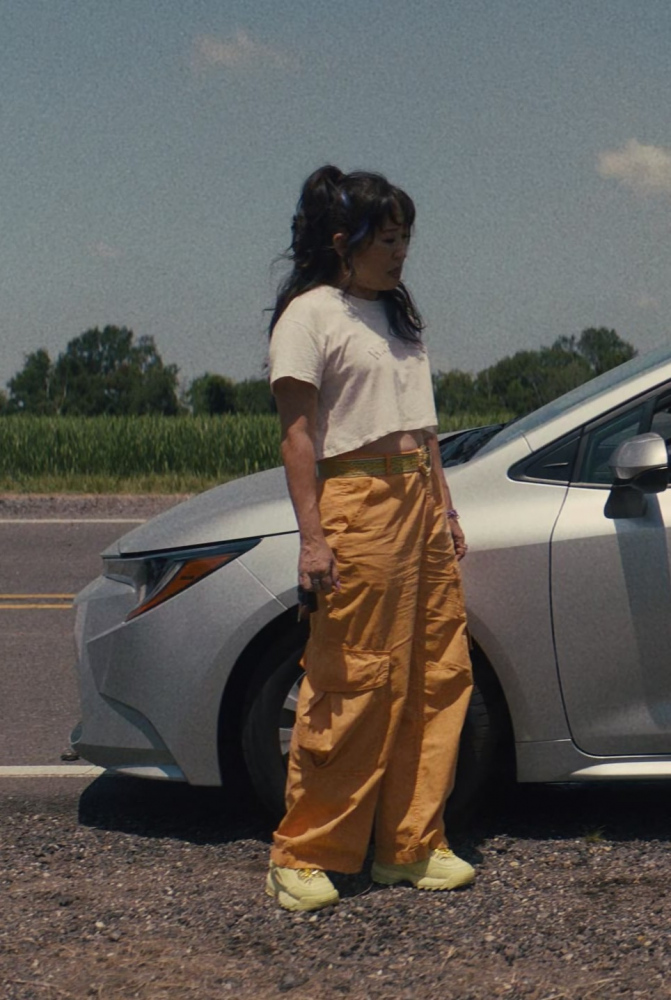 orange high rise cargo pants - Sandra Oh (Jenny Yum) - Quiz Lady (2023) Movie