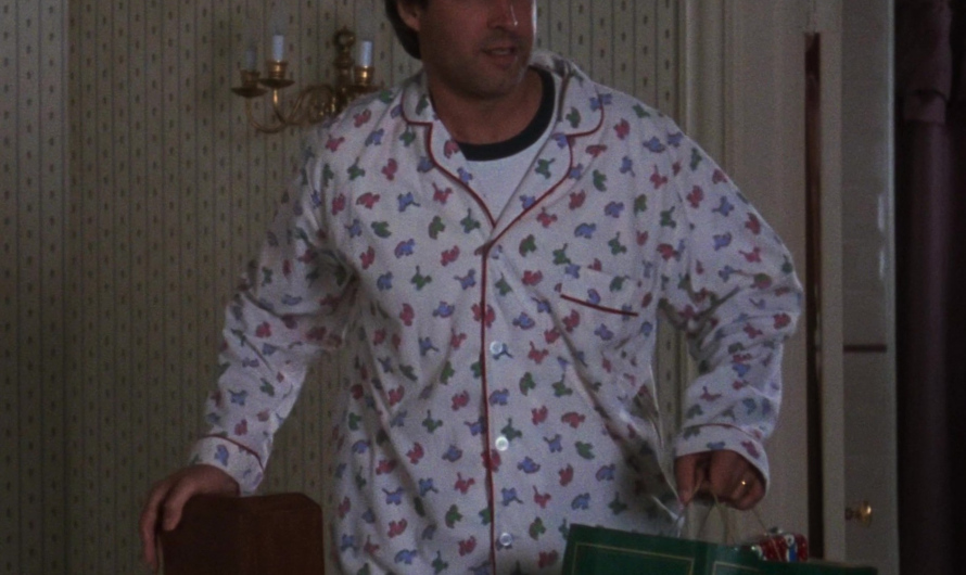 Classic Button-Up Pajama Set with Festive Dinosaur Print Worn by Chevy Chase as Clark W. “Sparky” Griswold Jr.
