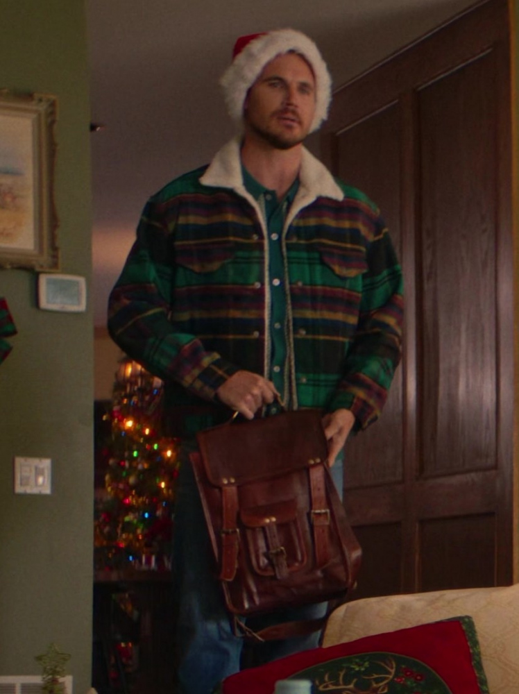 Classic Brown Leather Messenger Bag with Buckle Closures and Adjustable Strap of Robbie Amell as Graham Stroop from EXmas (2023) Movie