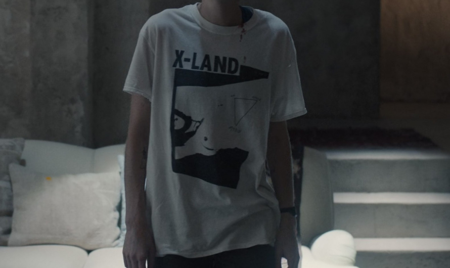 X-LAND Abstract Graphic Print T-Shirt Worn by Emma Corrin as Darby Hart