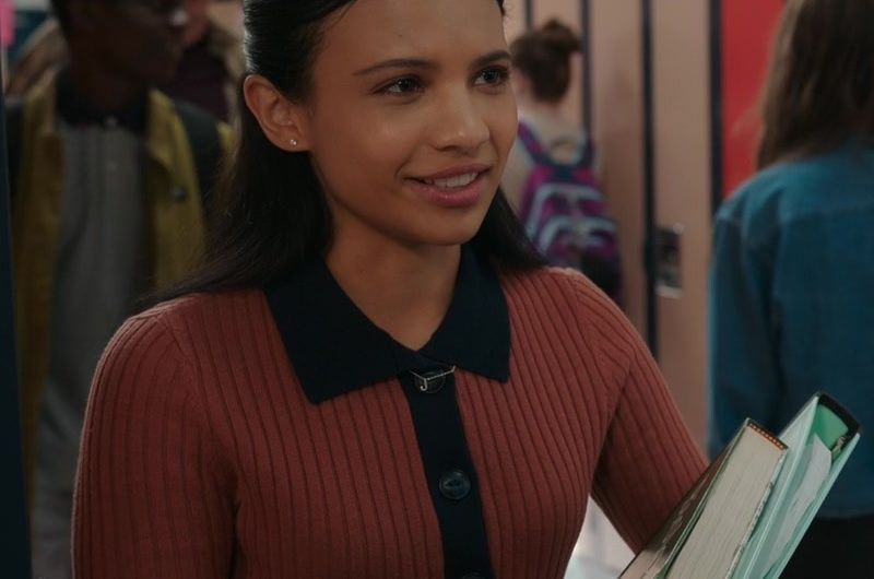 Ribbed Polo Sweater Cardigan with Dark Collar Accent Worn by Nikki Rodriguez as Jackie Howard