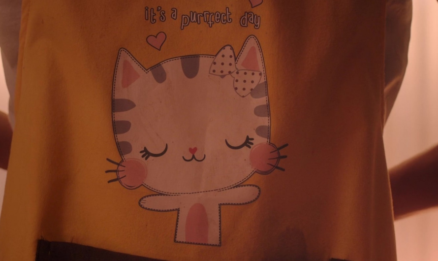 It’s a Purrfect Day Cat Logo Apron of Justin Chien as Charles Sun