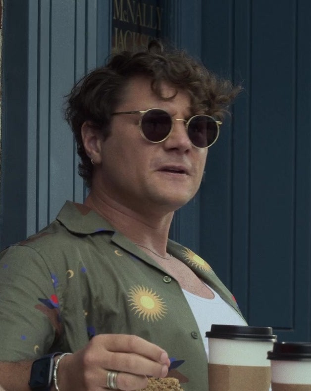 Olive Green Casual Button-Down Shirt with Unique Sun and Mountain Print Worn by Augustus Prew as Brannagan