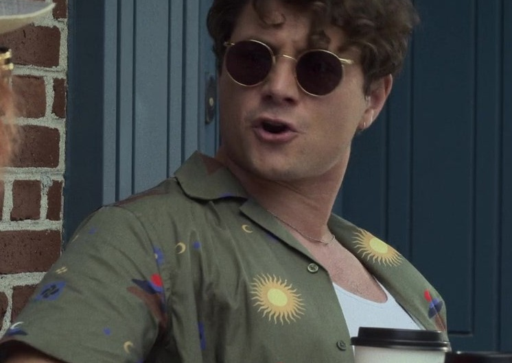 Round Frame Sunglasses with Dark Tinted Lenses and Gold Detailing of Augustus Prew as Brannagan