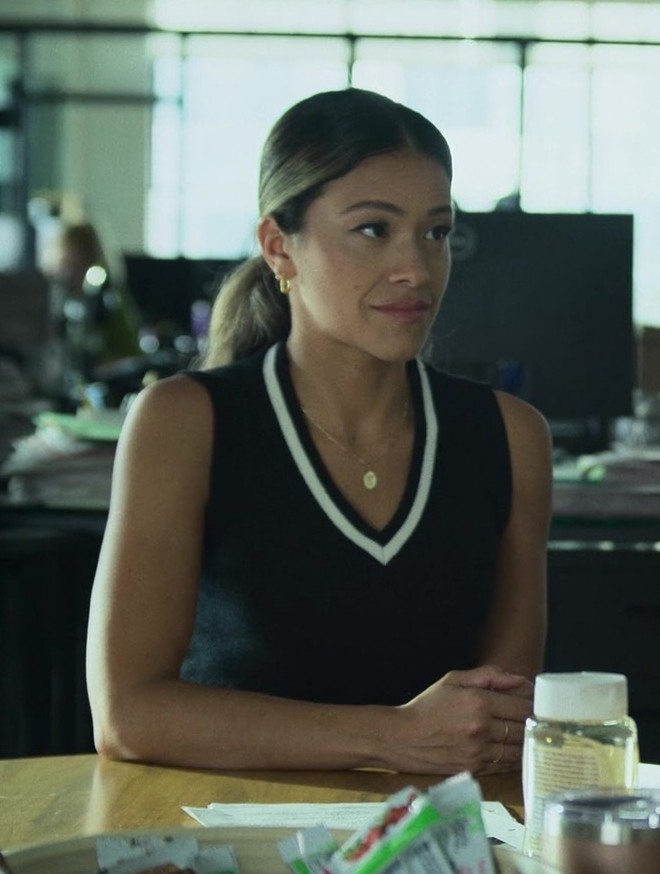 black sleeveless knit top with white v-neck collar detail - Gina Rodriguez (Mack) - Players (2024) Movie