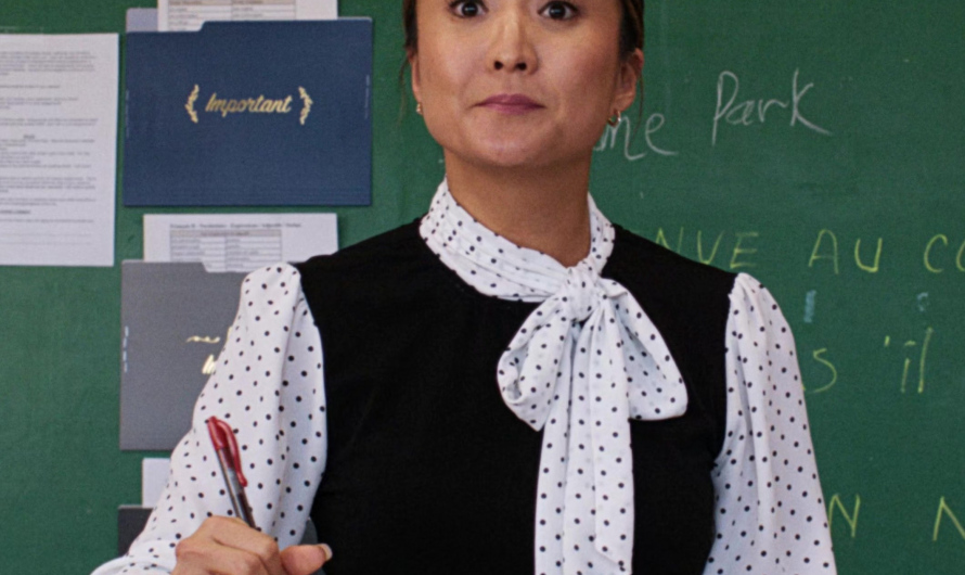 Polka Dot Chiffon Blouse with Bow Tie Neckline and Ruffle Worn by  Ashley Park as Madame Park