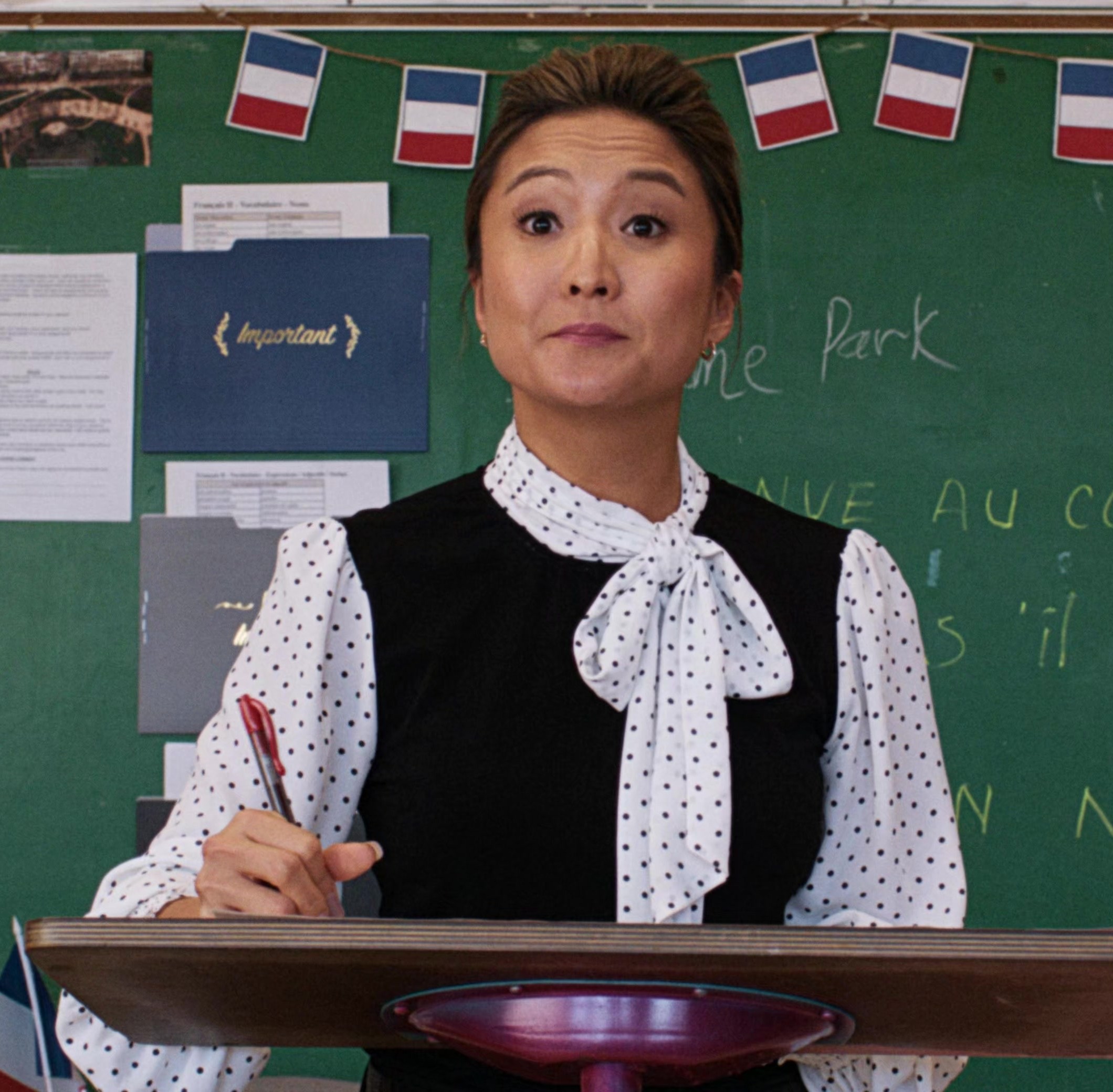 Polka Dot Chiffon Blouse with Bow Tie Neckline and Ruffle Worn by  Ashley Park as Madame Park