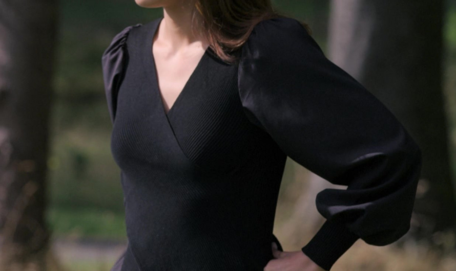 Black Peplum Top with Ribbed Texture and Statement Sleeves of Camila Mendes as Ana