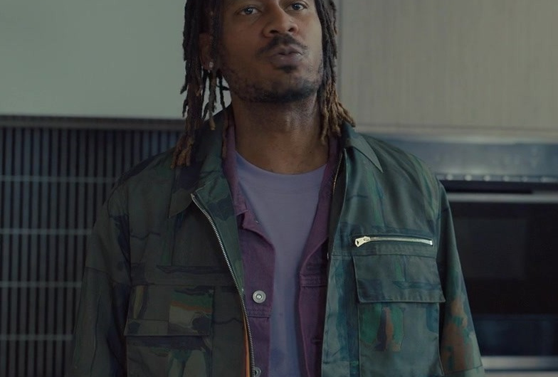 Military-Inspired Camouflage Field Jacket with Oversized Pockets and Zip Front Worn by GaTa as Pete