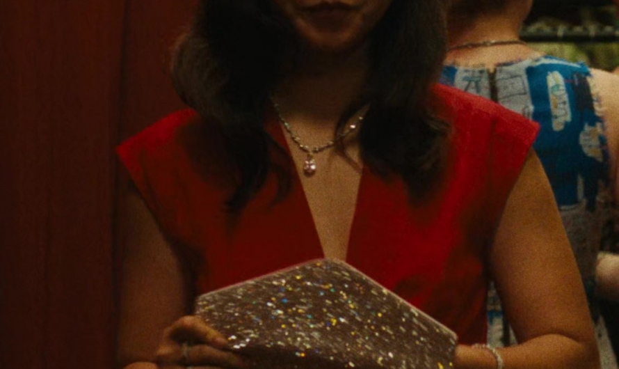 Glittering Champagne Gold Sequined Clutch Bag of Maya Erskine as Jane Smith