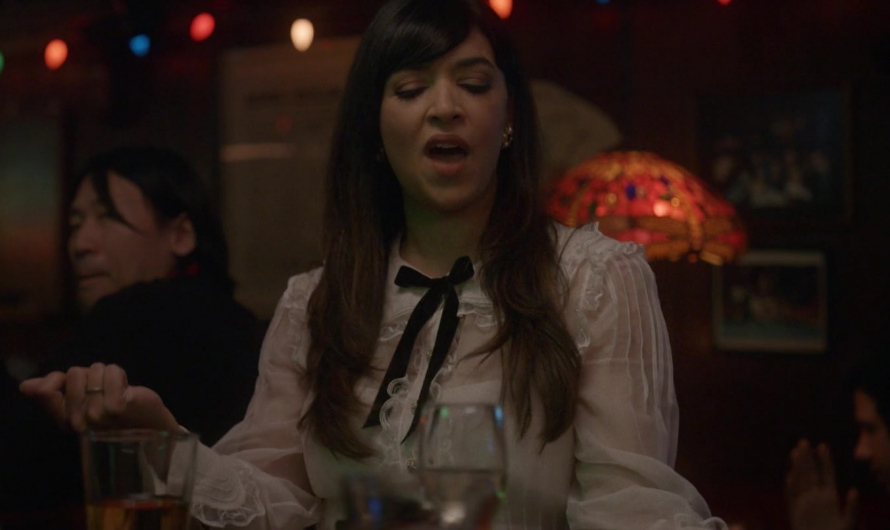 White Ruffle Blouse with Black Bow Tie Neck of Hannah Simone as Sam