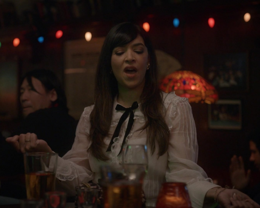White Ruffle Blouse with Black Bow Tie Neck of Hannah Simone as Sam