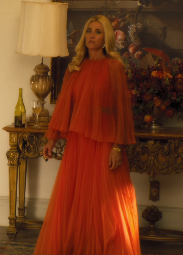 orange pleated maxi dress with cape sleeves - Kristen Wiig (Maxine Simmons) - Palm Royale TV Show