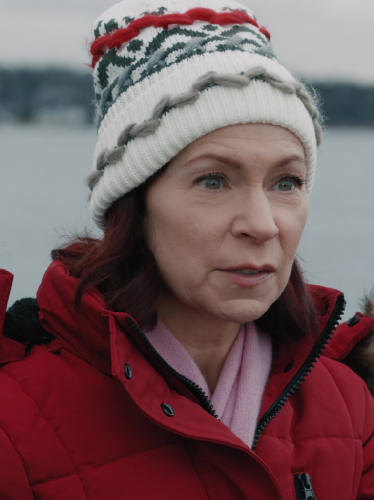white knit beanie with festive green and red pattern design - Carrie Preston (Elsbeth Tascioni) - Elsbeth TV Show