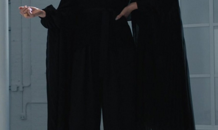 Black Wide Leg V-Neck Jumpsuit of Laura Benanti as Nadine Clay