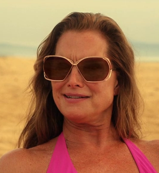 Glamorous Taupe Tinted Sunglasses with Broad Frames of Brooke Shields as Lana