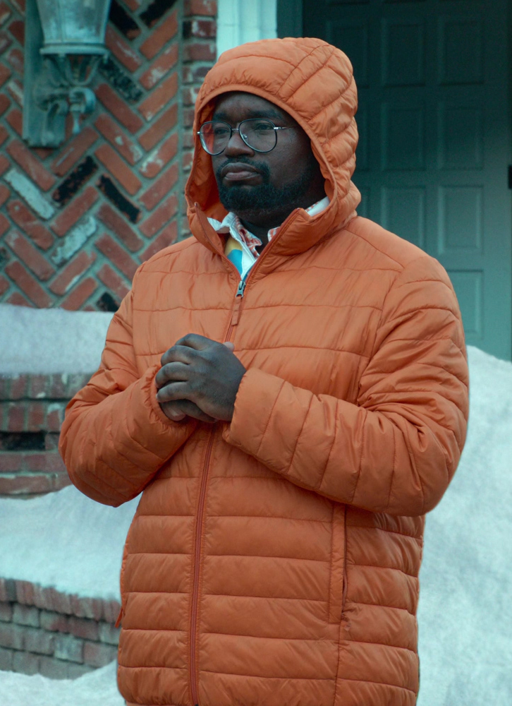 Orange Hooded Quilted Puffer Jacket of Lil Rel Howery as Ray