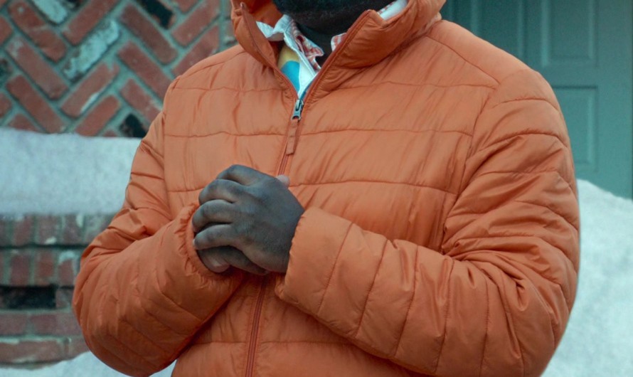 Orange Hooded Quilted Puffer Jacket of Lil Rel Howery as Ray